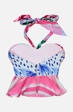 This cotton halter is a stunner. There’s a flattering peplum hem and ribbon straps along with a tropical pattern in a multicolored pink hue. An easy yet bold piece to add to your look, this tank top can be styled with everything from casual white denim to mini skirts. Make sure you pack it when heading off on vacation. 98% Cotton, 2% Elastane Sleeveless Halter top Exposed back zip Hand wash Made in Brazil Rococo Sand, Hemant And Nandita, Bodysuit Blouse, Cami Nyc, Amanda Uprichard, Jumpsuit Shorts Rompers, Peplum Hem, Tropical Pattern, Crop Top Sweater