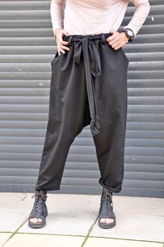 "Women Harem Pants, Black Wide Leg Pants, Drop Crotch Pants Black loose cotton pants, casual extravagant black pants. Woman black pants. Very comfortable loose pants. This pant is very convenient for your daily life. All my clothes are unique and boutique. Model wearring size: S SIZE S (US 6, UK 10, Italian 40, French 38, German 36, Japan 7) bust: fits bust around 35.5\" / 90cm Waist: fits waist around 28\"/ 71cm Hips: fits hips around 38\"/ 97cm For overall height: 5'5\" / 165cm around Shop siz Oversized Black Pants With Pockets, Oversized Black Harem Pants Casual Style, Oversized Black Casual Harem Pants, Baggy Black Sweatpants For Spring, Black Non-stretch Wide Leg Sweatpants, Black Baggy Sweatpants For Spring, Baggy Black Harem Pants With Pockets, Black Oversized Bottoms For Fall, Black Baggy Wide-leg Sweatpants