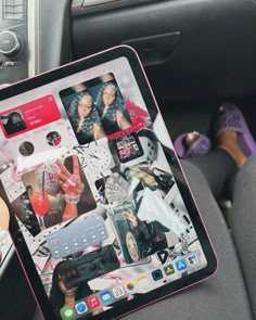 a person holding up an ipad in their car with pictures on the front and back