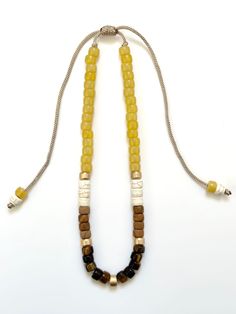 Beautiful beaded necklace with natural stone beads featuring tigers eye. Accented with gold plated beads. Custom orders can be made using gold filled or solid gold beads. Direct message for custom order. Adjustable slide knot allows necklace to slip over the head and you can adjust to your preferred length. Custom orders can be made if you would prefer a clasp instead. This necklace is the perfect addition to a basic white tee or just as beautiful dressed up for a special event. It layers well with other colored beaded necklaces from this store or your other favorite necklaces you already have. Custom pieces will be final sale. Stone Bead Necklace, Beautiful Beaded Necklaces, Basic White Tee, Natural Stone Beads, Stone Beaded Necklace, Ice Tea, Pony Beads, Tigers Eye, Beaded Necklaces