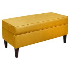 an upholstered bench with wooden legs and a foot rest in yellow fabric, against a white background