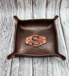 the personalized leather tray is on display