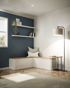 a living room with blue walls and white shelves on the wall next to a window