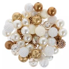 a bunch of white and gold beads on top of each other in various sizes, shapes and colors