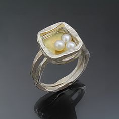 Gold, Silver & Pearl Ring - Forged, hammered, and soldered by hand, this statement ring is made of sterling silver and 18k gold and features a rectangular element hiding a cluster of luxe pearls. Available in whole, half, and quarter sizes 59. Rectangular Ring, Silver Pearl Ring, Artful Home, Silver Pearls, Pearl Ring, Statement Ring, Statement Rings, Silver Gold, Original Art