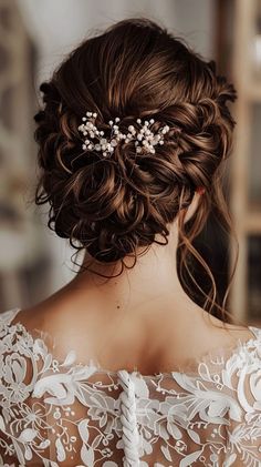 the back of a woman's head wearing a bridal hair comb