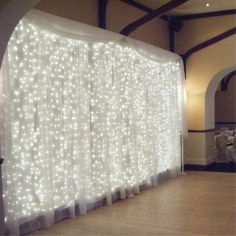 a large white curtain with lights on it