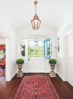 the front door is clean and ready to be used as a room divider in this house