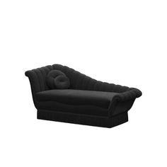 a black couch sitting on top of a white floor