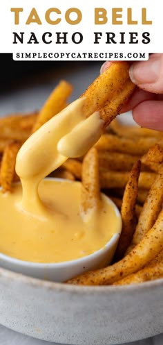 a person dipping cheese into some fries with the words taco bell nacho fries