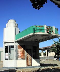 an old gas station sits empty in the middle of nowhere