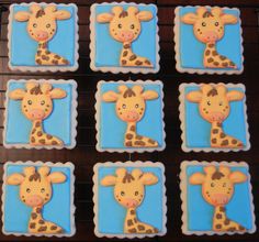 six decorated cookies in the shape of giraffes