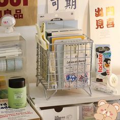 a shopping cart sitting on top of a white table next to boxes and other items