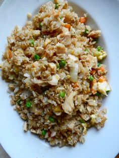 a white plate topped with chicken fried rice