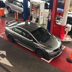 a car is parked at a gas station