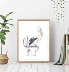 a bird sitting on top of a toilet in a room next to a potted plant