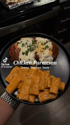 chicken parmesan on a plate with cheese and other food items in the background