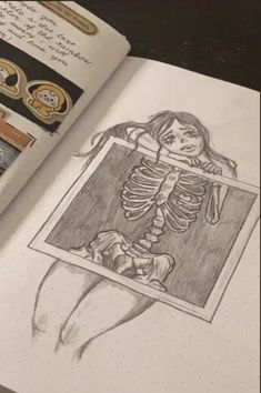 an open book with a drawing of a skeleton in it's corner and some stamps on the pages