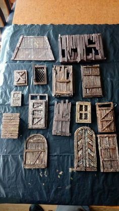 some wooden doors and windows on a table