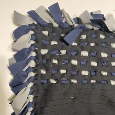 a piece of cloth with blue and white squares on it