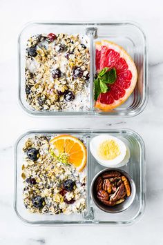 two plastic containers filled with food on top of a white marble countertop next to each other