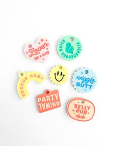 several tags that say party twiny and have smiley faces on them, all in different colors