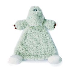 a stuffed animal in a green dress on a white background