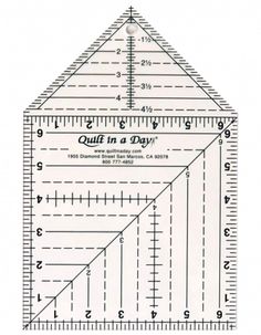 a ruler is shown with the words quilt in a day written on it's side