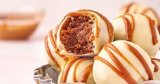 some kind of cake ball with caramel drizzled on the top and inside