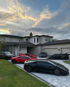 a bunch of cars parked in front of a house