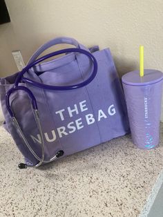 a purple bag with a stethoscope next to it on a counter top