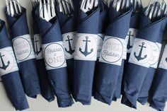 there are many blue napkins that have an anchor on them with the words happy birthday and one