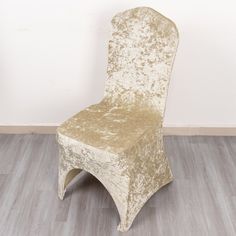 a chair that is sitting on the floor in front of a wall and wood floor