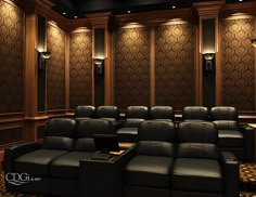 an empty theater room with black leather seats