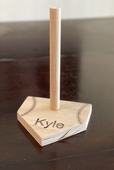 a wooden baseball bat on top of a table