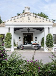 a car is parked in front of the marbella club hotel's main entrance