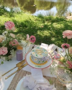 there is a cake on the table with flowers