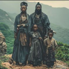 an african family standing on top of a mountain