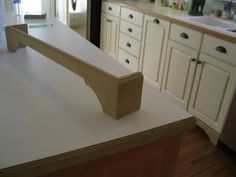 a kitchen counter with a wooden handle on it