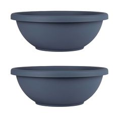 two blue bowls sitting next to each other