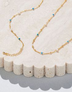 DESCRIPTION Elevate your jewellery game with the Rosa Necklace in Gold and Turquoise by Jolie & Deen. This delicate chain necklace features a stunning combination of natural turquoise stones and freshwater pearls, creating a minimalist yet eye-catching piece. Perfect for both casual and formal wear, this necklace adds a pop of subtle colour and sophistication to any outfit. Whether worn on its own for a soft statement or layered with other necklaces for a chic, trendy look, this piece is a versa Natural Turquoise Stone, Delicate Chain, Turquoise Stones, Natural Turquoise, Layering Pieces, Turquoise Stone, Formal Wear, Freshwater Pearls, Layering