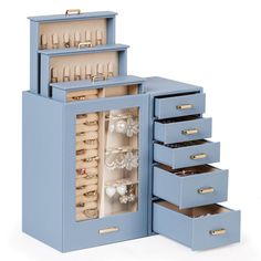 a blue jewelry box with five drawers