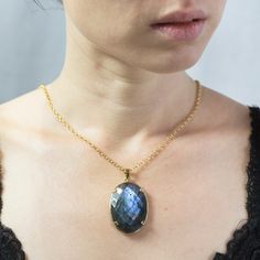 This round faceted Labradorite stone is set in 14K yellow gold vermeil and is truly eye-catching with its electrifying blue & multi-colored sheen. Labradorite is the stone of vitality and originality, allowing you to be yourself. Stone Origin: Madagascar Measures Approximately: 26 x 38 mm Materials: Labradorite Gemstone & Hand Crafted 925 Sterling Silver with a 14k Yellow Gold Vermeil Finish Please Note: If you would like to purchase a different chain please purchase pendant only and click here. Gold Labradorite Oval Pendant Necklace, Gold Oval Pendant Necklace In Labradorite, Gold Oval Gemstones With Large Stone, Gold Oval Labradorite Necklaces, Oval Labradorite Necklace With Large Stone, Elegant Labradorite Oval Pendant Necklace, Gold Oval Labradorite Necklace, Oval Gold Labradorite Necklace, Belcher Chain