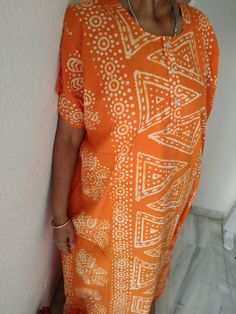 Orange cotton kaftan Bohemian Batik Print Kimono For Summer, Bohemian Batik Print Sarong For Vacation, Traditional Summer Sarong For Vacation, Traditional Summer Vacation Sarong, Orange Short Sleeve Beachwear Dress, Bohemian Batik Print Kimono For Vacation, Flowy Orange Bohemian Kaftan, Orange Bohemian Beach Dress, Orange Short Sleeve Maxi Dress For Vacation