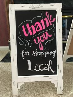 a chalkboard sign with the words thank you for shopping i look written on it