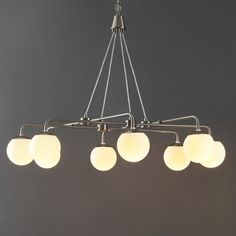 a chandelier with five lights hanging from it