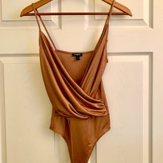 Silky, Soft, And Sultry. Great Base Piece For Under Blazer Or As Stand-Alone Top. Very Warm Tones. Plunge Neck. Snaps For Easy On/Off. Very Stretchy. Size Small. Fitted Orange V-neck Bodysuit, Sleeveless Brown Bodysuit For Spring, Fitted Orange Bodysuit With Lined Body, Spring Party Brown Bodysuit, Elegant Brown Bodysuit For Summer, Elegant Brown Summer Bodysuit, Orange Party Bodysuit For Spring, Tank Bodysuit, Gold Orange