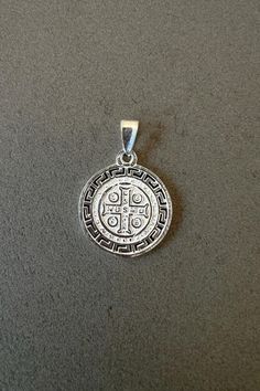 Saint Benedict medal for her St Benedict pendant for him sterling silver St Benedict jewelry protection pendant gift religious jewelry gift Round shaped medal with the image of Saint Benedict constructed of 925 silver.  The front of the medal will have the image of the noble St. Benedict of Nursi, and the back of the medal will show the letters C S S M L - N D S M D. These letters are the initials of the words, "Crux sacra sit mihi lux! Non draco sit mihi dux!" In English, they translate to, "Ma Personalized Sterling Silver Medallion, Hallmarked Silver Jewelry For Blessing, Silver Hallmarked Jewelry For Blessing, Silver Jewelry With Large Pendant For Blessing, Silver Cross Pendant Jewelry For Commemoration, Saint Benedict Medal, Protection Pendant, Benedict Medal, Saint Benedict