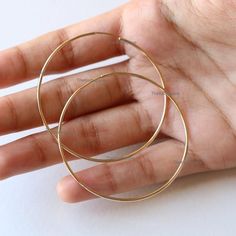 Delicate 14K Gold Hoops, Round Plain Big Hoop Earrings, Dainty Plain Hoop Earrings, Christmas Gift Earrings, Fine Handmade Jewelry.Product info:14k solid gold1.1mm ThicknessHoop Size: 2 inchesItem will be resized and shipped within 10 days.ITEM Will BE SHIPPED : India Speed PostTo get the item in 4-5 days, we can also ship it thru DHL express, please contact us before.Please select your size at the drop down menu.Thanks!♥Shipping Policy,:Processing time is 2-3 weeks. We will provide you tracking 14k Gold Circle Hoop Earrings Gift, 14k Gold Round Hoop Earrings For Gift, 14k Gold Filled Pierced Round Hoop Earrings, 14k Stamped Huggie Hoop Earrings As Gift, 14k Gold Huggie Hoop Earrings Gift, Handmade Yellow Gold Hoop Earrings For Anniversary, Tarnish Resistant Hoop Earrings For Gift, Nickel-free Yellow Gold Round Hoop Earrings, 14k Gold-filled Hoop Earrings With Ear Wire For Anniversary