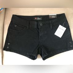 Nice Short Pants From Guess. Never Worn. No Damages Waist 14” On Flat Black Cotton Bottoms With Button Closure, Black Mid-rise Pants With Button Closure, Black Stretch Bottoms With Button Closure, Casual Black Bottoms With Button Closure, Trendy Black Cropped Pants, Trendy Black Short Length Pants, Black Summer Pants With Button Closure, Trendy Black Short Pants, Fitted Short Pants With Button Closure